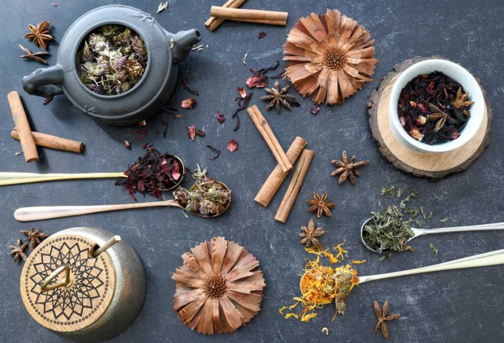 flat lay of loose tea leaves, teapot and cups