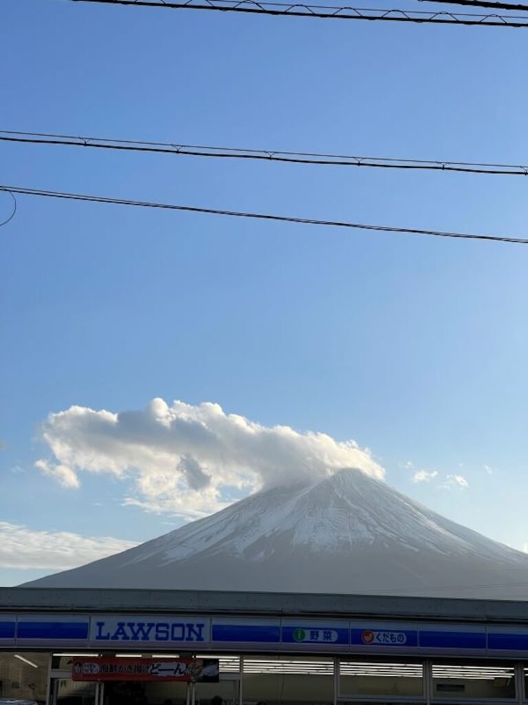 View of mount fuji on a clear blue day with the famous Lawson right in front