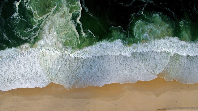 Aerial view of a secluded cove with turquoise water in the Balearic Islands