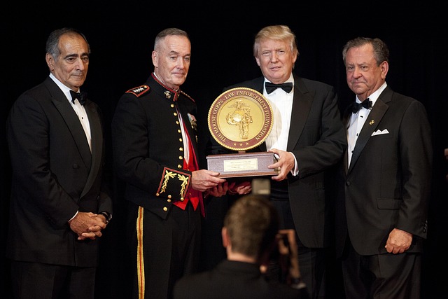 Donald Trump walking with others at an outdoor event (trump health news)