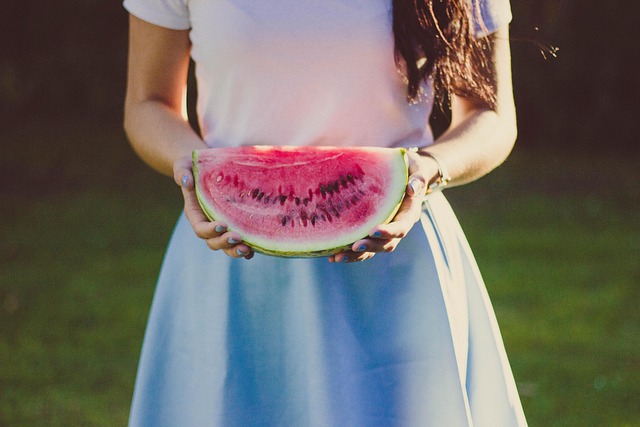 Person holding a package of Selena Gomez Oreos with a smile.